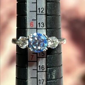 Sterling silver, with blue and white moissanite stones ring.